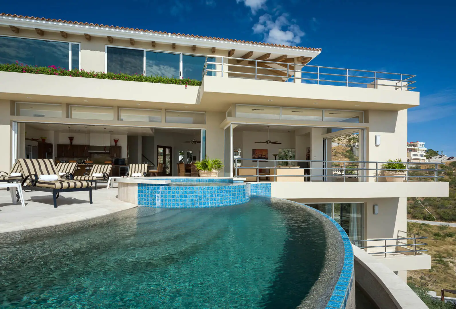 Pedregal Luxury Homes for Sale marina-side residence with city lights and ocean backdrop near Cabo Marina