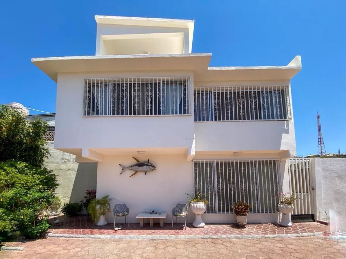 Pedregal Centro Exceptional property for sale in the heart of La Paz, Baja California Sur.Located on Lic. Primo Verdad Street in the highly desirable Centro area, this spacious residence blends authentic Baja character with functional modern living. Ideal for families, investors, or developers, the property offers privacy, generous indoor and outdoor spaces, and excellent connectivity to the city's main attractions, restaurants, schools, universities, and shopping areas.Set on a 13,490.52 ft lot with 3,791.58 ft of construction, the home combines the charm of traditional Baja California Sur architecture with tasteful modern upgrades that enhance comfort and functionality.An outstanding added value is its zoning potential, allowing development of up to 7 levels making this an excellent opportunity. for residential living, a boutique project, vacation rental investment, remodeling, or vertical development in one of La Paz's fastest-growing and most connected areas.Property LayoutThe property features 5 bedrooms and 3 full bathrooms distributed between two independent structures:Main Residence* 3 bedrooms* 2 bedrooms with private en-suite bathrooms* Third-level flex room ideal for: * Home office * TV/media room * Gym * Art studio * Game roomIndependent Guest House* 2 additional bedrooms* Shared full bathroom* Perfect for guests, extended family, teenagers, rental income, or private office spaceInterior Features* Spacious and naturally fresh living areas* Large kitchen with excellent functionality* Renovated bathrooms* Polished concrete finishes and authentic architectural details* Layout designed for both entertaining and privacyOutdoor LivingThe exterior spaces are one of the property's greatest highlights, featuring:* Expansive patio and garden areas* Mature fruit trees and lush landscaping* Natural shaded gathering spaces* Outdoor bar and barbecue area* Covered entertainment terrace* Multiple relaxing outdoor corners ideal for family and social gatheringsAdditional Features* Private garage with electric gate* 10,000-liter underground cistern for reliable water storage* Extensive outdoor areas* Multifunctional spaces* Excellent investment and development potential* Prime central location with privacy and tranquilityA unique opportunity to own a character-filled property with exceptional lot size, versatile spaces, and strong development potential in the center of La Paz. – 1030 Calle Lic. Primo Verdad, La Paz, BS