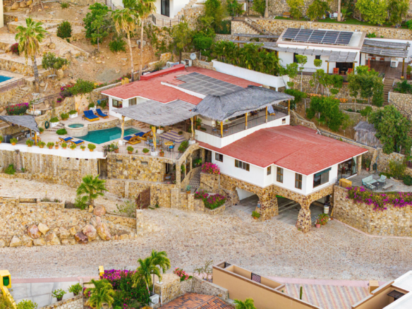 Pedregal Pedregal Csl Villa Felicidad is a 5-bedroom, 5.5-bath residence in Pedregal that combines scale, location, and proven income potential. Set just minutes from the main gate and within walking distance to the marina, it offers effortless access to Cabo's best dining and nightlife while maintaining privacy. The home features a private pool, expansive terraces, and panoramic marina – 25 Camino Grande Pedregal, Cabo San Lucas, BS
