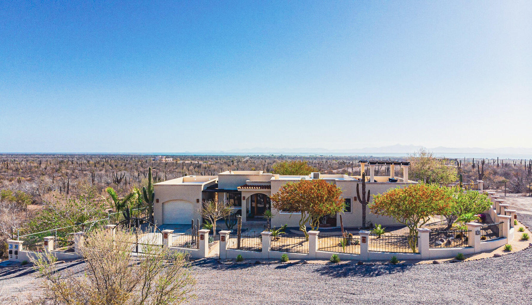 Pedregal Haciendas Palo Verde Tucked into a quiet cul-de-sac in sought-after Haciendas Palo Verde, this fully walled and fenced property delivers the La Paz lifestyle in every direction -- literally. The main house offers 2 bedrooms and 2 bathrooms, plus a private 1BR/1BA casita, poolside half-bath, and separate office/studio. The updated kitchen features stainless appliances, granite counters, and a stunning live-edge mesquite bar top. Entertain effortlessly in the expansive pool area with a full outdoor kitchen -- BBQ, fridge, and sink included -- then head up to the rooftop terrace for breathtaking 360-degree sunset and ocean – 3400 P. Finisterra, San Jose del Cabo, BS