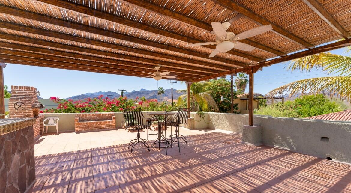 Pedregal Centro Casa Paloma, a delightful residence featuring 2 bedrooms, 2.5 bathrooms, a refreshing dipping pool, and ample space for parking a boat or RV.This newly constructed bungalow is just a few blocks from the beach and within a short walking, biking, or golf cart ride to the charming seaside Malecon and Loreto's historic town square, where you'll find a variety of restaurants and coffee shops.This inviting single-story home is situated on a secured lot and boasts an open-concept kitchen and living area. It includes a guest bedroom with a full bathroom, as well as a ensuite that opens up to the back patio, complete with a tranquil water feature, dipping pool, and outdoor shower. A convenient half bathroom is located by the poolside for easy access. Additionally this property also provides the potential for future expansion, whether you envision adding a second floor or expanding the ground level.This charming casita comes fully furnished and is perfect as a full-time residence, vacation retreat, or rental property. – Alborada, Loreto, BS