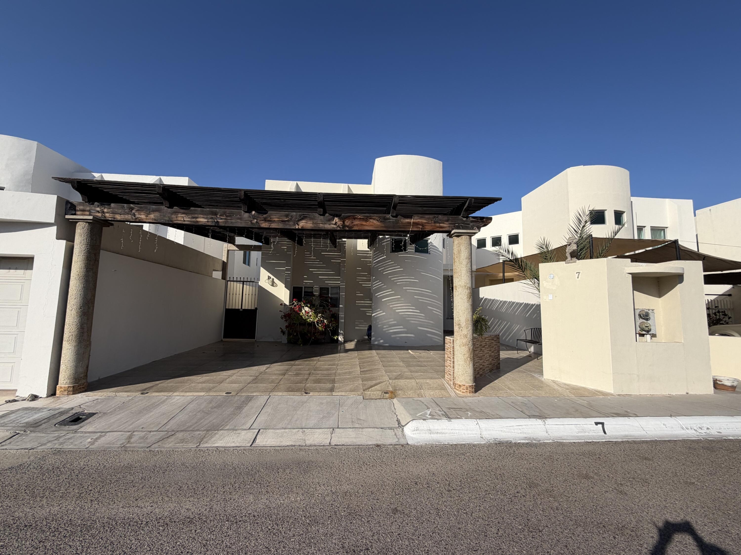 Pedregal Los Barriles This unique property is in a prime location.Just steps from the beautiful beaches of Los Barriles.You are in town so walking to multiple restaurants and shops is easy without a car.Upon entering from the street, on your left is the first garage with an attached bedroom,bathroom and a covered patio.The main house has 1 bedroom, 1 1⁄2 bathrooms, kitchen, dining area, laundry room and livingroom that opens to a large covered patio. On the other side of the patio are 2 bedrooms and 2bathrooms.Directly behind the 2 bedrooms and bathrooms is a casita with 1 bedroom, 1 bathroom, fullkitchen, dining area, living room, laundry room and covered patio.There is also a detached extra deep garage in the back of the property for storing cars, sideby sides, quads or gear. This 5-bedroom, 5.5-bathroom property with 2 garages and 2 laundry rooms is ideal for a winter getaway and offers great rental income opportunities. – AQUILES SERDAN, La Paz, BS