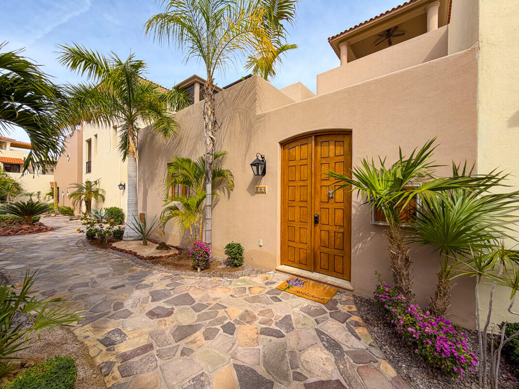 Pedregal Agua Viva Introducing AV 231, an extraordinary corner residence featuring a side yard and stunning vistas of the Sea of Cortez, golf course, and nearby islands. This delightful Nueva Chica home is in impeccable condition, exuding warmth and brightness. The main level showcases an open-concept living and kitchen area that seamlessly transitions into a private garden. The kitchen boasts a generous pantry, upgraded neutral granite countertops, stainless steel appliances, a secondary water heater, and an under-sink water purification system. The serene garden retreat is equipped with two gated entrances and offers ample space for bicycles, sports gear, and even pets. Just outside the back gate, you'll discover a charming flagstone veranda that overlooks a beautifully landscaped community courtyard. Completing the ground level is a lovely primary en-suite bathroom featuring dual sinks.Ascend to the second-level terrace, a perfect space for unwinding and entertaining, complete with a built-in BBQ area and breathtaking – Avenida Punta Arenas, Loreto, BS