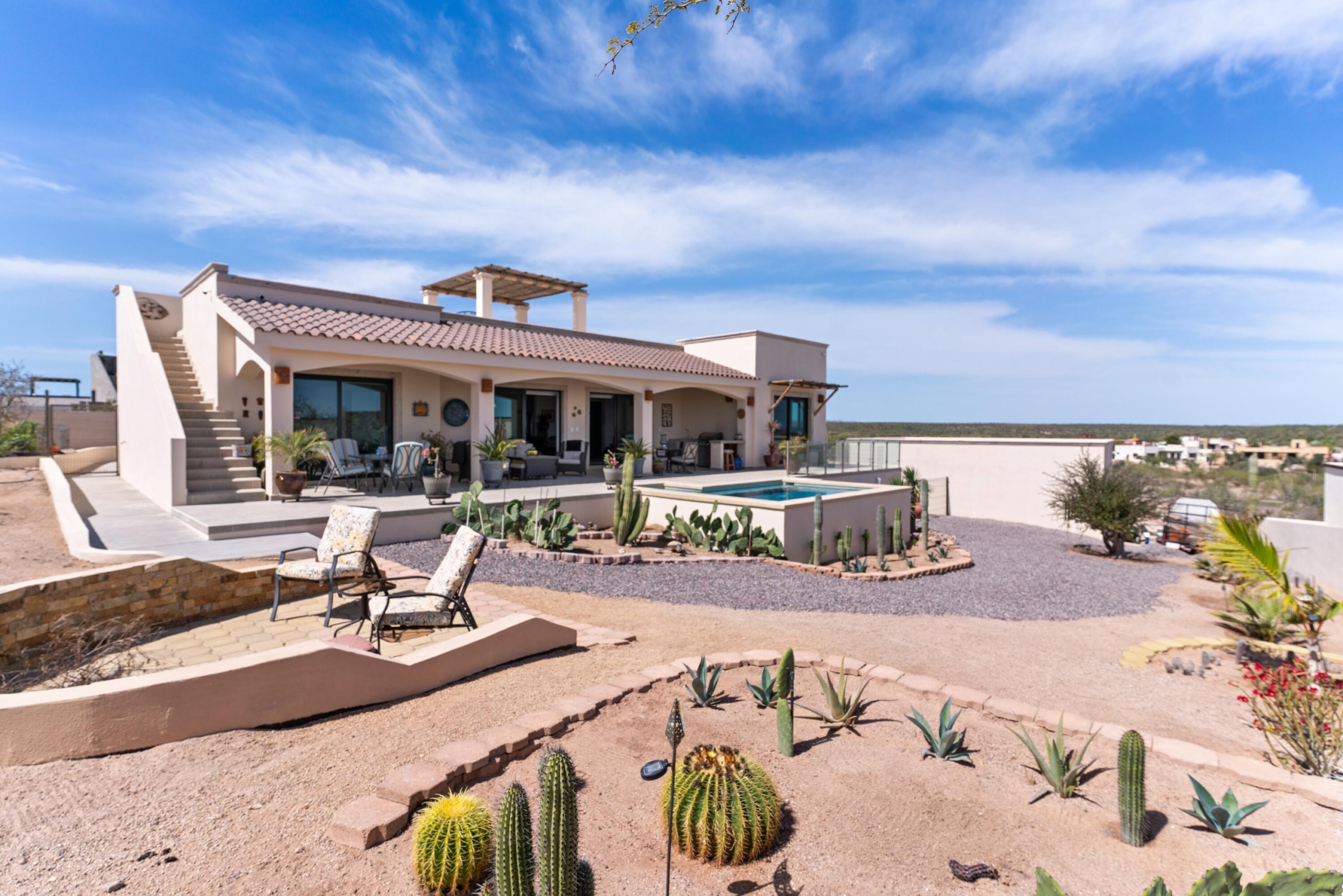 Pedregal Centro Casa Paloma, a delightful residence featuring 2 bedrooms, 2.5 bathrooms, a refreshing dipping pool, and ample space for parking a boat or RV.This newly constructed bungalow is just a few blocks from the beach and within a short walking, biking, or golf cart ride to the charming seaside Malecon and Loreto's historic town square, where you'll find a variety of restaurants and coffee shops.This inviting single-story home is situated on a secured lot and boasts an open-concept kitchen and living area. It includes a guest bedroom with a full bathroom, as well as a ensuite that opens up to the back patio, complete with a tranquil water feature, dipping pool, and outdoor shower. A convenient half bathroom is located by the poolside for easy access. Additionally this property also provides the potential for future expansion, whether you envision adding a second floor or expanding the ground level.This charming casita comes fully furnished and is perfect as a full-time residence, vacation retreat, or rental property. – Calle Calamar, La Paz, BS