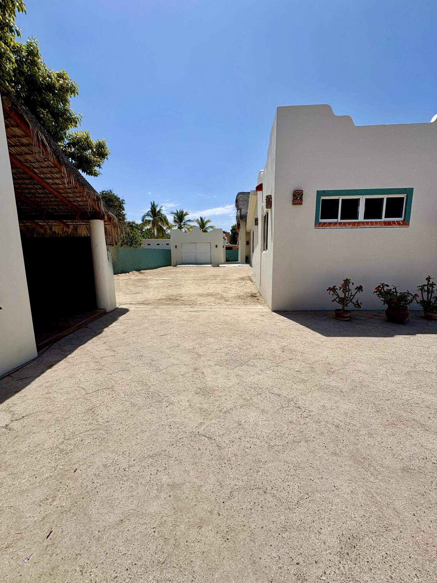 Pedregal Los Barriles This unique property is in a prime location.Just steps from the beautiful beaches of Los Barriles.You are in town so walking to multiple restaurants and shops is easy without a car.Upon entering from the street, on your left is the first garage with an attached bedroom,bathroom and a covered patio.The main house has 1 bedroom, 1 1⁄2 bathrooms, kitchen, dining area, laundry room and livingroom that opens to a large covered patio. On the other side of the patio are 2 bedrooms and 2bathrooms.Directly behind the 2 bedrooms and bathrooms is a casita with 1 bedroom, 1 bathroom, fullkitchen, dining area, living room, laundry room and covered patio.There is also a detached extra deep garage in the back of the property for storing cars, sideby sides, quads or gear. This 5-bedroom, 5.5-bathroom property with 2 garages and 2 laundry rooms is ideal for a winter getaway and offers great rental income opportunities. – Calle Don Pepe, Los Barriles, East Cape, BS