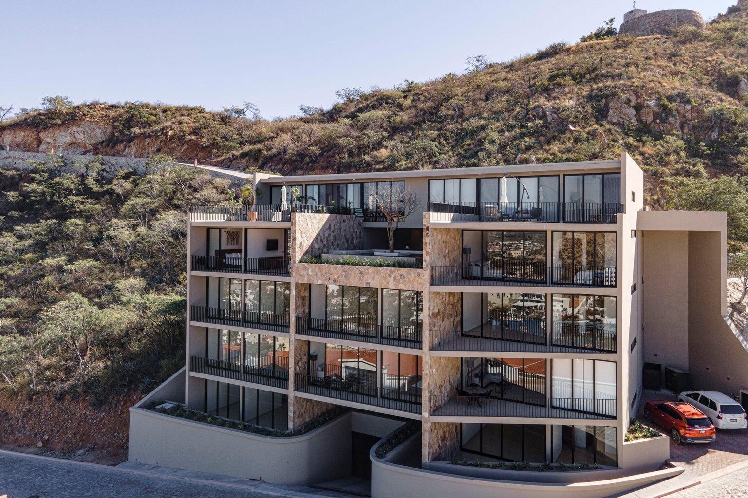 Pedregal Pedregal One Experience the pinnacle of sophisticated Cabo living in this turnkey 2-bedroom, 2-bathroom luxury condominium nestled in the legendary hillside enclave of Pedregal. Boasting modern, contemporary finishes, this premium residence features a sleek minimalist design integrated with a spacious covered terrace--making it the ultimate canvas for indoor-outdoor Baja entertainment.Breathtaking, unobstructed vistas overlooking the sparkling city lights, rugged mountain ranges, and nearby marina. Over 1,600 square feet equipped with high-end stainless steel appliances and a premium extended kitchen island.The Location has unmatched walkability. Skip the car ride and stroll straight down to world-class sportfishing charters, upscale waterfront dining, and vibrant nightlife at the Marina Cabo San Lucas.Exclusive Amenities: 24/7 controlled security, private Pacific beach access, professional tennis/pickleball clubs, a luxury health spa, an organic farmers' market, and a dedicated community water desalination plant. Includes 2 covered underground parking spaces. for sale