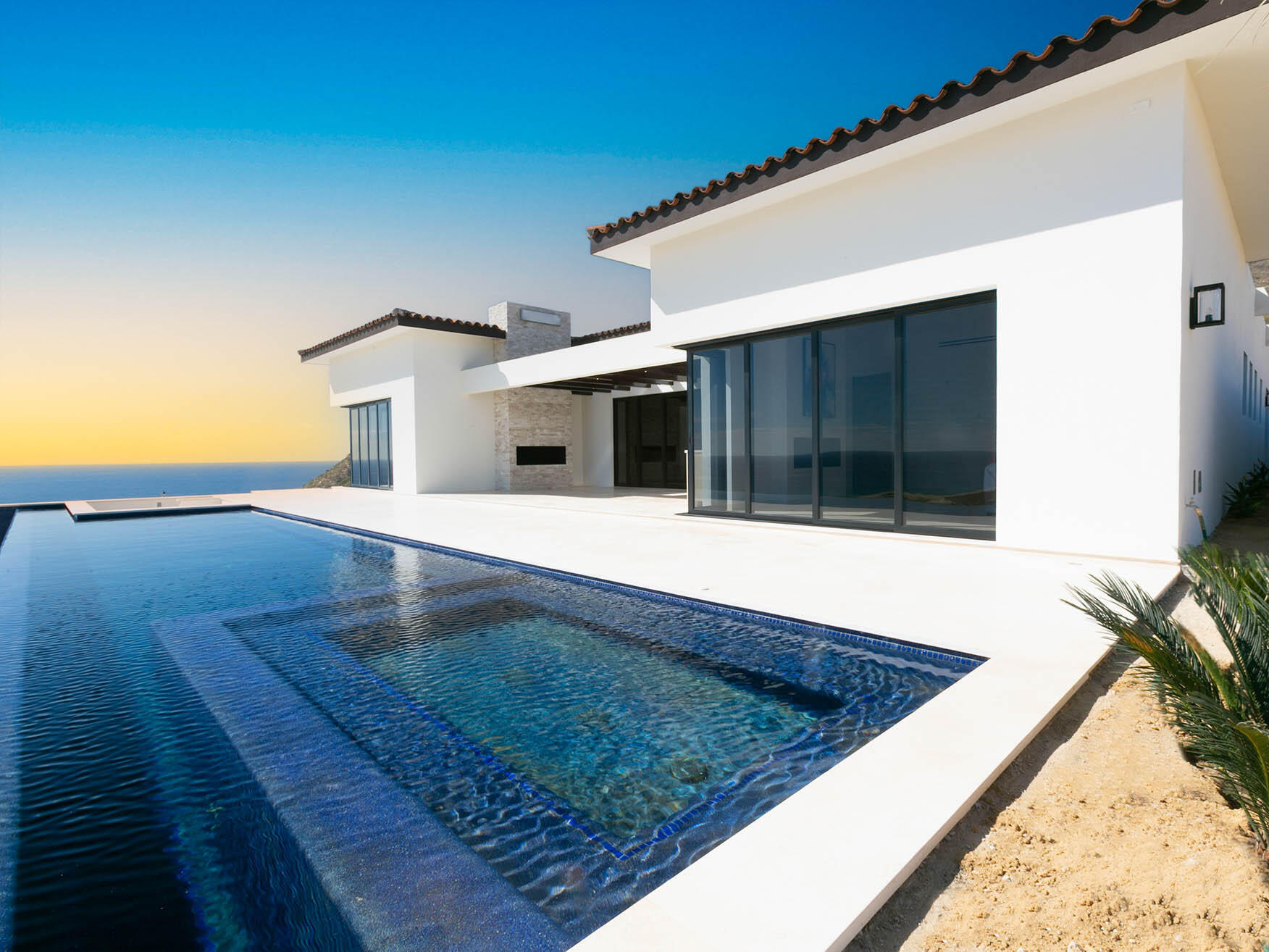Pedregal Copala Lot 40 is a stunning two-story residence featuring dual primary suites on the upper level, offering expansive Pacific Ocean for sale