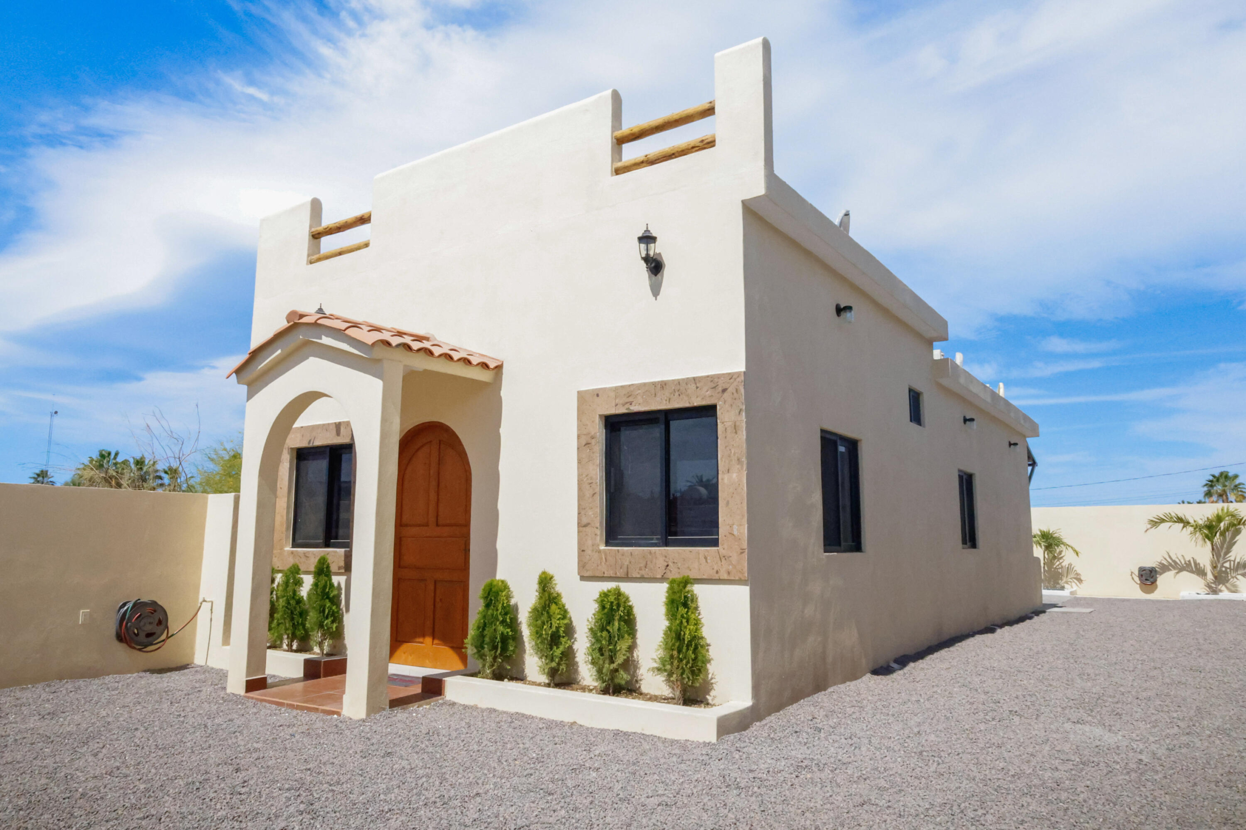 Pedregal Centro Casa Paloma, a delightful residence featuring 2 bedrooms, 2.5 bathrooms, a refreshing dipping pool, and ample space for parking a boat or RV.This newly constructed bungalow is just a few blocks from the beach and within a short walking, biking, or golf cart ride to the charming seaside Malecon and Loreto's historic town square, where you'll find a variety of restaurants and coffee shops.This inviting single-story home is situated on a secured lot and boasts an open-concept kitchen and living area. It includes a guest bedroom with a full bathroom, as well as a ensuite that opens up to the back patio, complete with a tranquil water feature, dipping pool, and outdoor shower. A convenient half bathroom is located by the poolside for easy access. Additionally this property also provides the potential for future expansion, whether you envision adding a second floor or expanding the ground level.This charming casita comes fully furnished and is perfect as a full-time residence, vacation retreat, or rental property. – sn Independencia, Loreto, BS