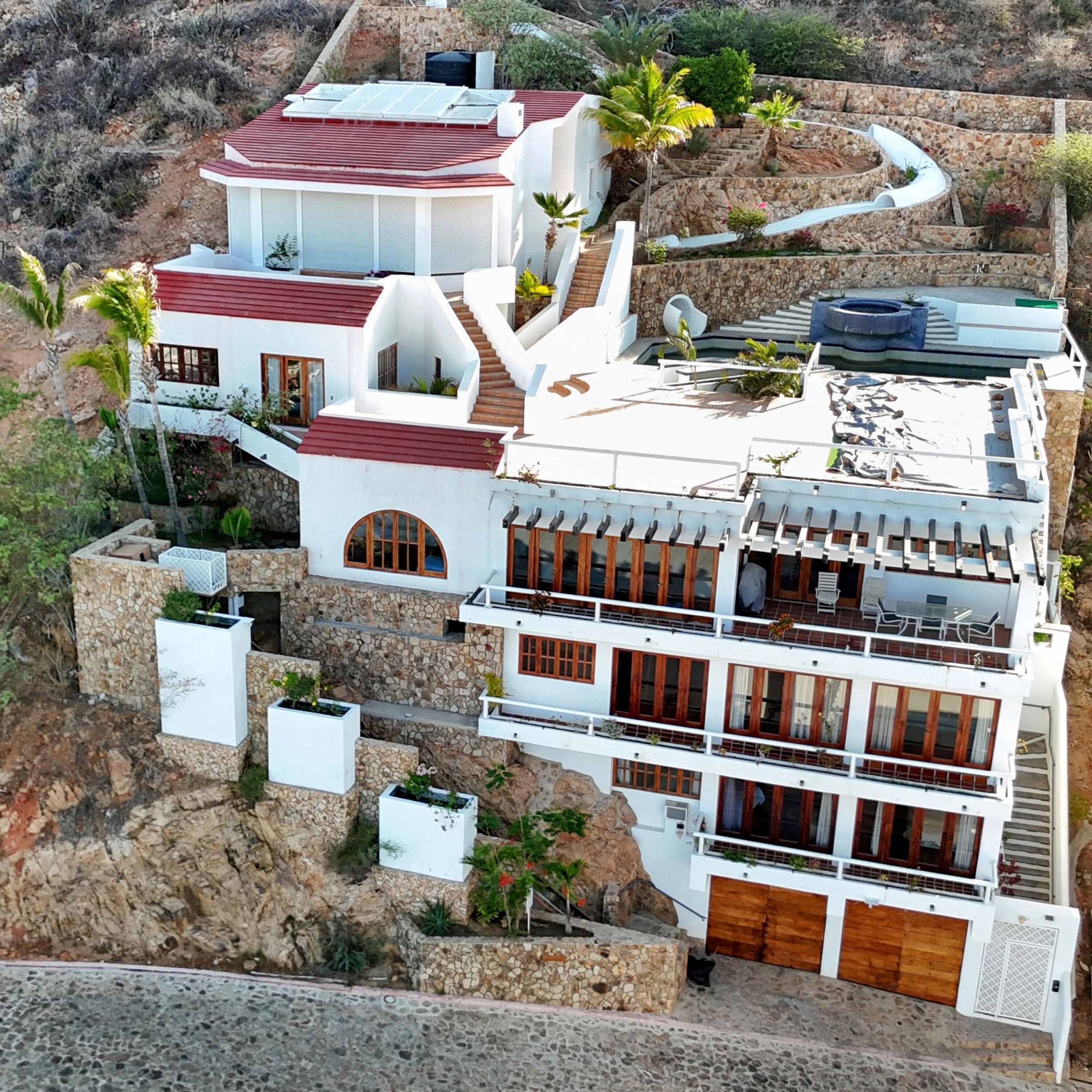 Pedregal Pedregal Csl Perched high above the marina and the Sea of Cortez, this extraordinary 10,000-square-foot estate is one of Pedregal's most iconic residences. Carved into the granite hillside, the property represents a remarkable piece of Cabo San Lucas history and offers an architectural experience unlike any other in Los Cabos.Panoramic for sale